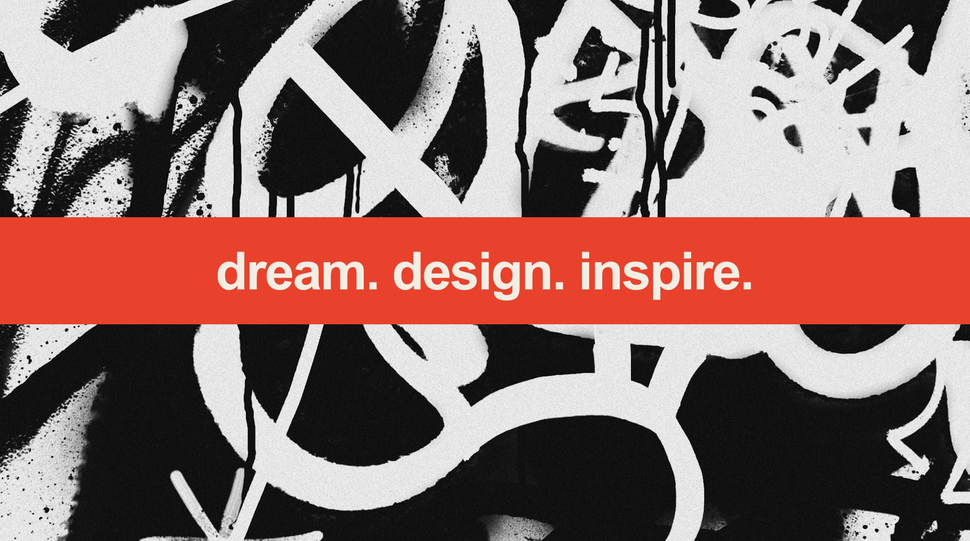 Dream. Design. Inspire. — bold black-and-white graffiti with the slogan on a red band.